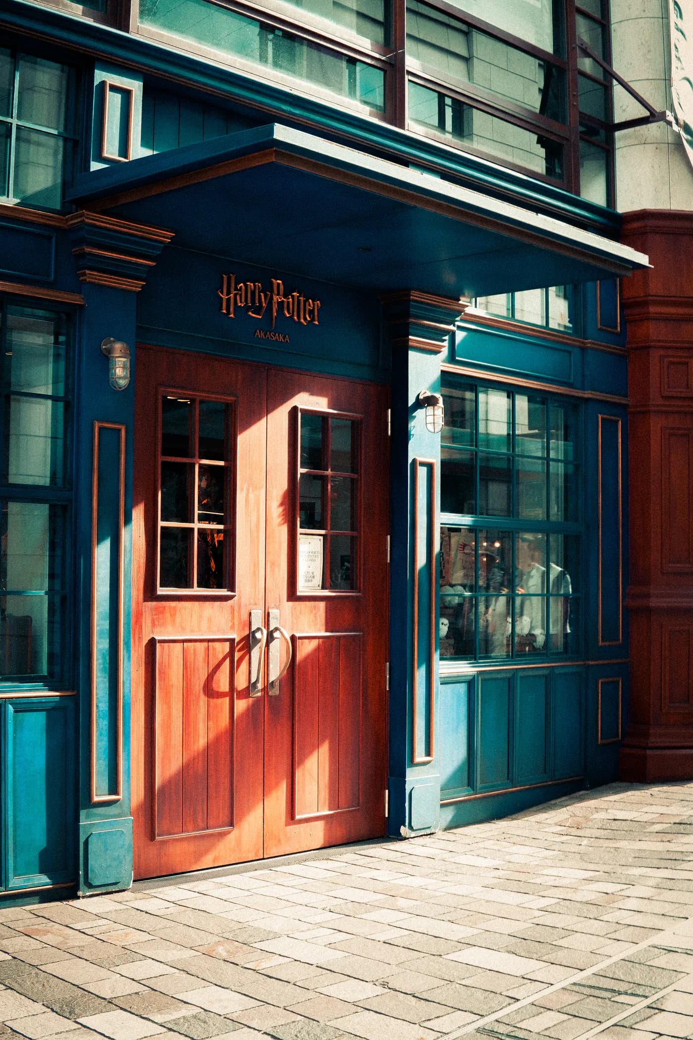The Harry Potter Akasaka storefront with blue and red timber panels